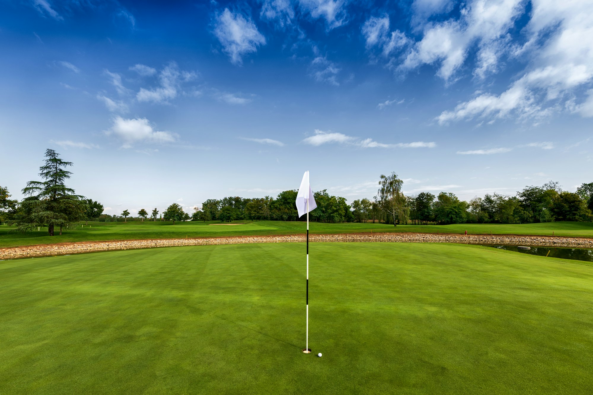 White flag of hole on golf course